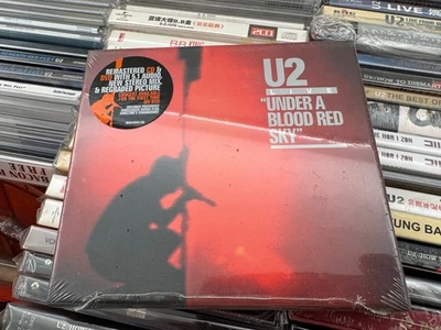 U2 : CD/DVD UNDER A BLOOD RED SKY - USA DELUXE EDITION STILL SEALED - Bild 1 von 2