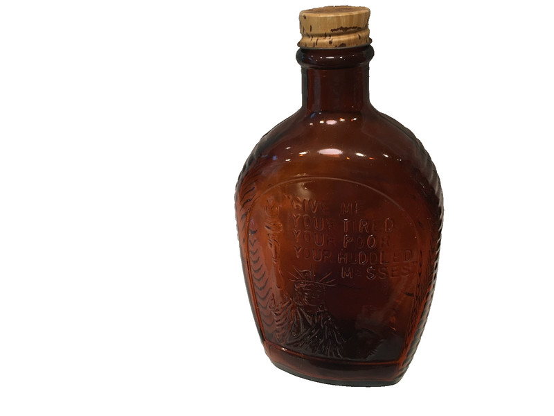 Log Cabin Bicentennial syrup bottle 'Statue of Liberty' design, amber glass