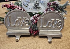 PAIR OF BRUSHED METAL LOVE CHRISTMAS STOCKING HOLDERS FOR MANTLE STOCKING HANGER