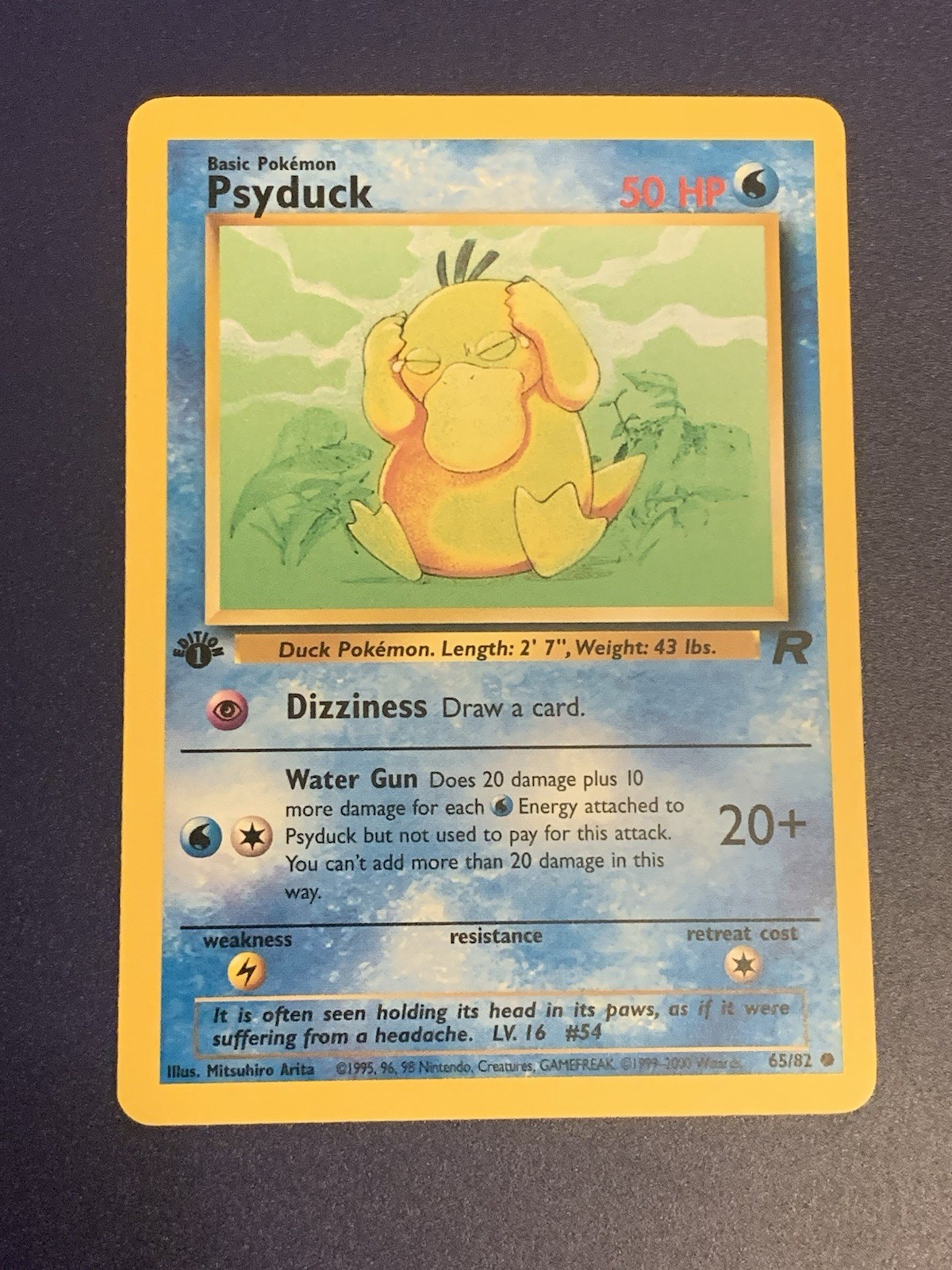 Psyduck 1st First Edition 65/82 Pokémon Card 2000 Team Rocket Near Mint