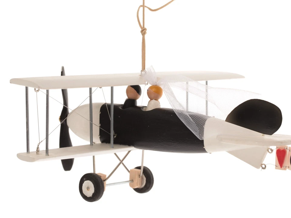 Un avión sobre un soporte, centros de mesa para mesa de boda. Banner personal Foto 2 de 4