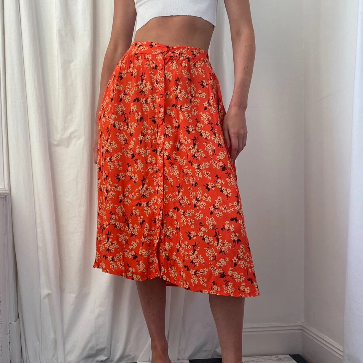 Orange skirt cream top top