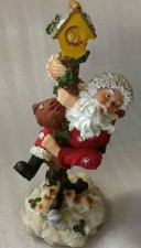 Santa Claus Climbing Pole to Escape Playful Puppies Figurine 9