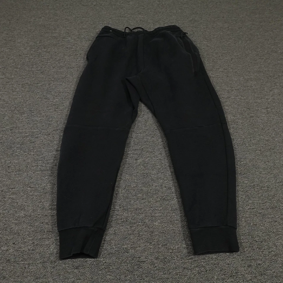 Pantalones Nike Juveniles Medianos Negros Tecnología Polar Joggers Pantalones de Sudadera con Puños Cónicos Foto 3 de 4