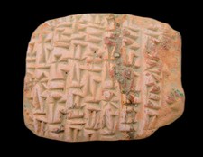 ANCIENT NEAR EASTERN TERRACOTTA TABLET WITH EARLY FORM OF WRITING