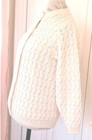 Cream knit women's long sleeve sweater with scalloped pattern, made in the USA on mannequin.