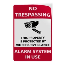 Vertical Vinyl Sticker Sign Protected By Video Surveillance Alarm System