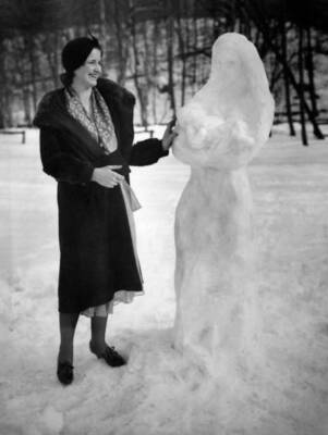 Young woman admiring a snow statue a Virgin Child a park Washi- 1932 Old Photo