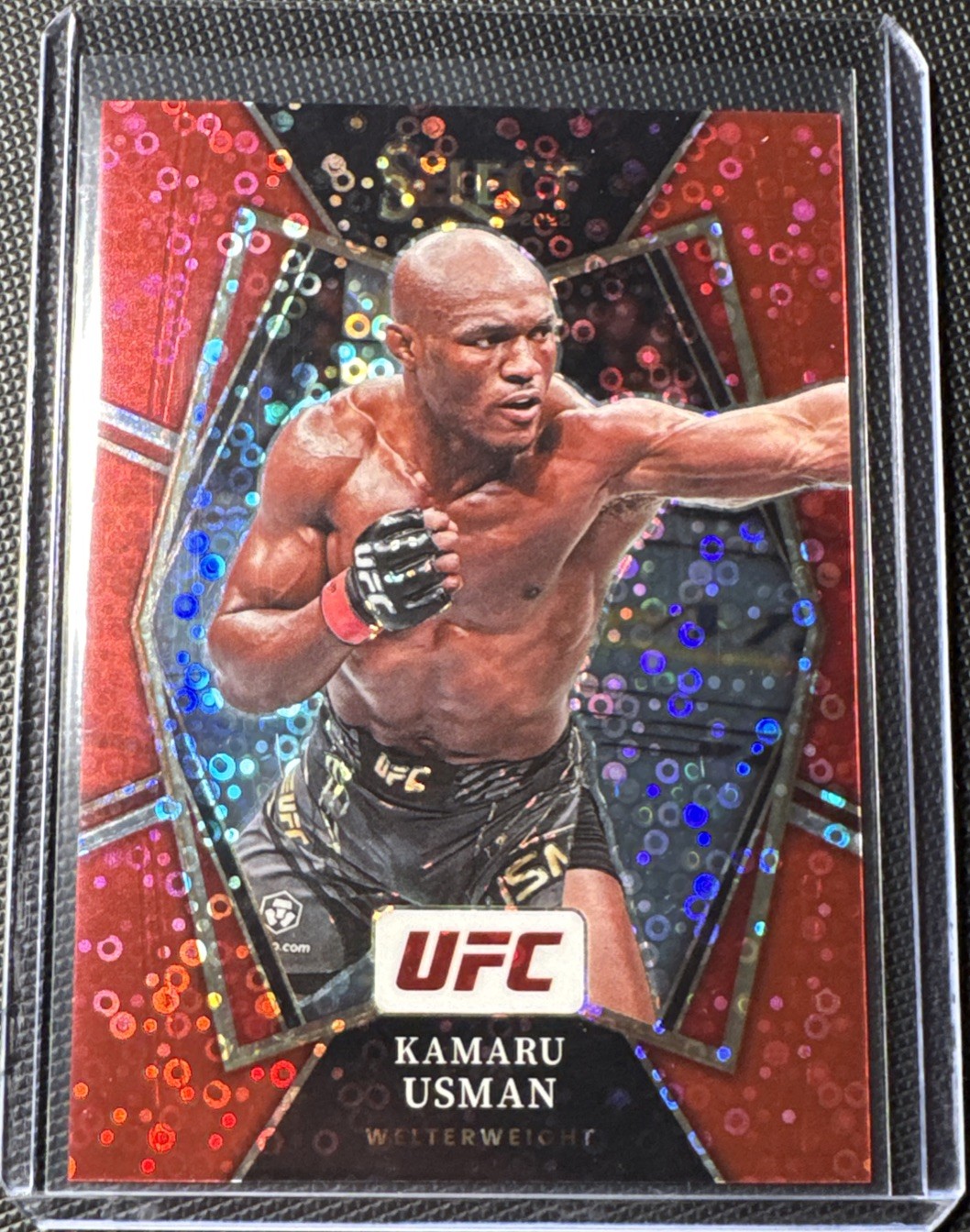 2022 Panini Select UFC #101 Kamaru Usman Red Disco Prizm /99 Premier Level