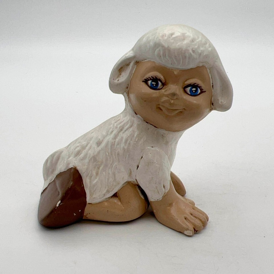A 1970s ceramic lamb figurine with an unsettlingly realistic human face — creepy, bizarre, and absolutely perfect for someone who collects the weird side of vintage.