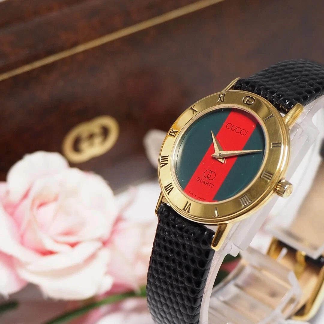 Boîte montre femme Gucci Sherry Line ceinture cuir F474