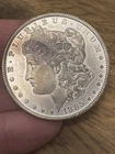 AU+ 1885 (P) Morgan Silver Dollar Slightly Toned
