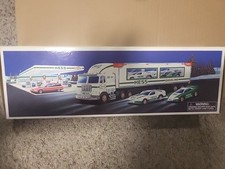 1997 HESS TOY TRUCK AND RACERS with 2 STOCK CAR STYLE RACE CAR (322)