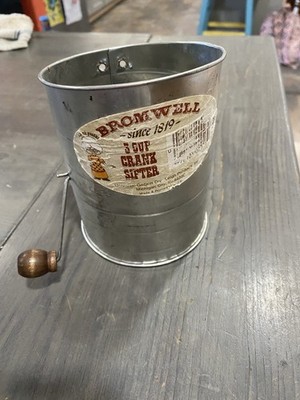 vintage Jacob Bromwell 3-cup flour sifter, a collectible kitchen utensil.