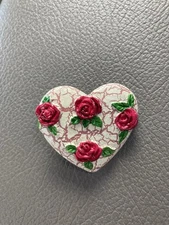 Vintage “Earth Heart” Pin With Four Roses On A Crackled Earth.