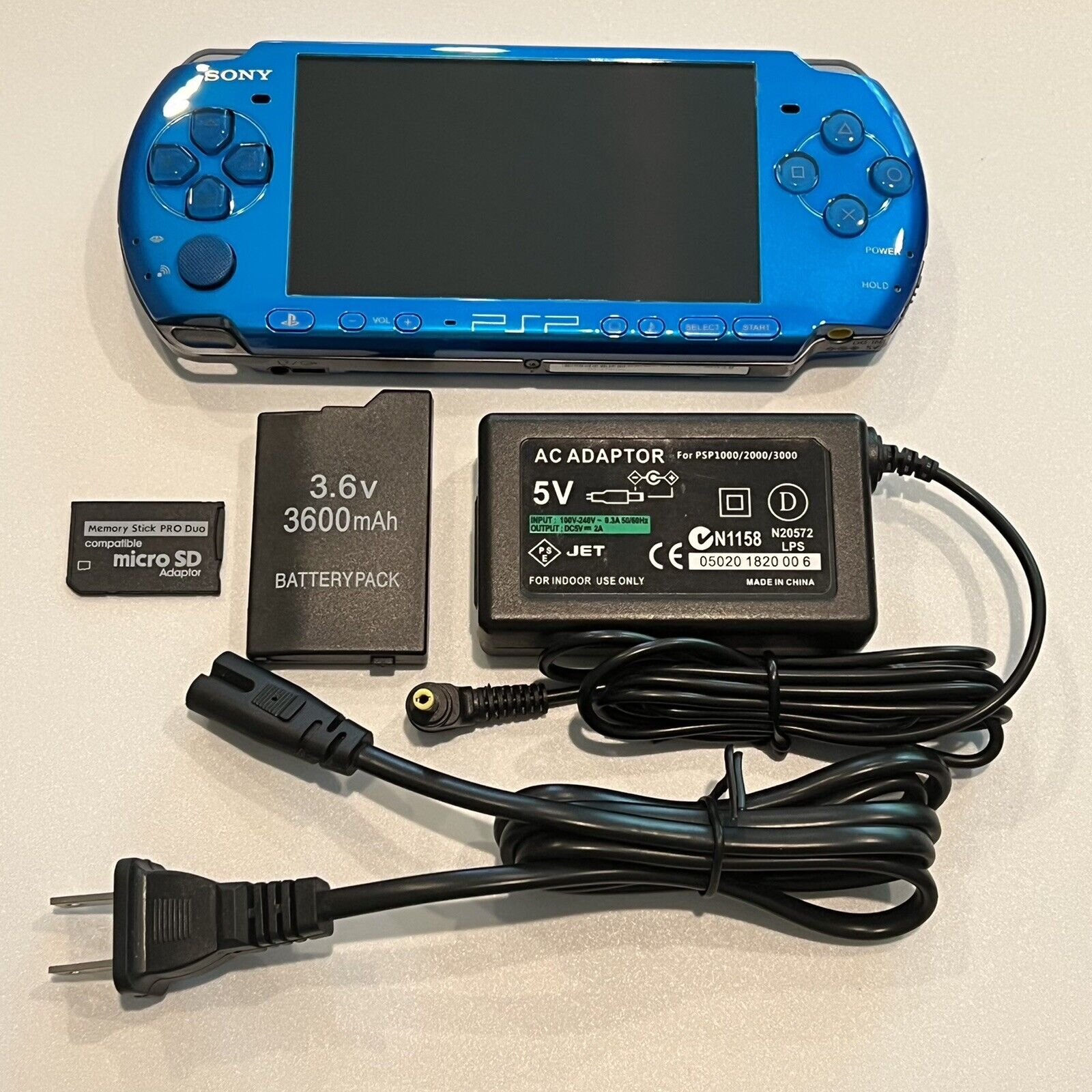 VIBRANT BLUE PSP 3000 System w/ Charger, Battery, 64gb Memory Card Bundle  Import