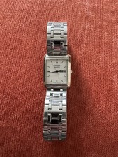 Citizen Quartz rectangular wristwatch, specifically model BE0030