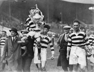 The winning team of a rugby match with the cup London England May - Old Photo