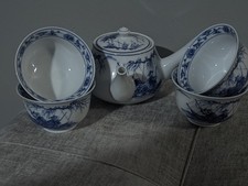 Japanese tea set, featuring a kyusu side-handled teapot and four cups,