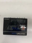 vintage Sony Walkman WM-F77 portable cassette player with FM/AM radio