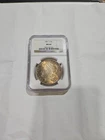 1881 "S" MORGAN SILVER $1 "NGC MS64" - WITH SOME TONING.