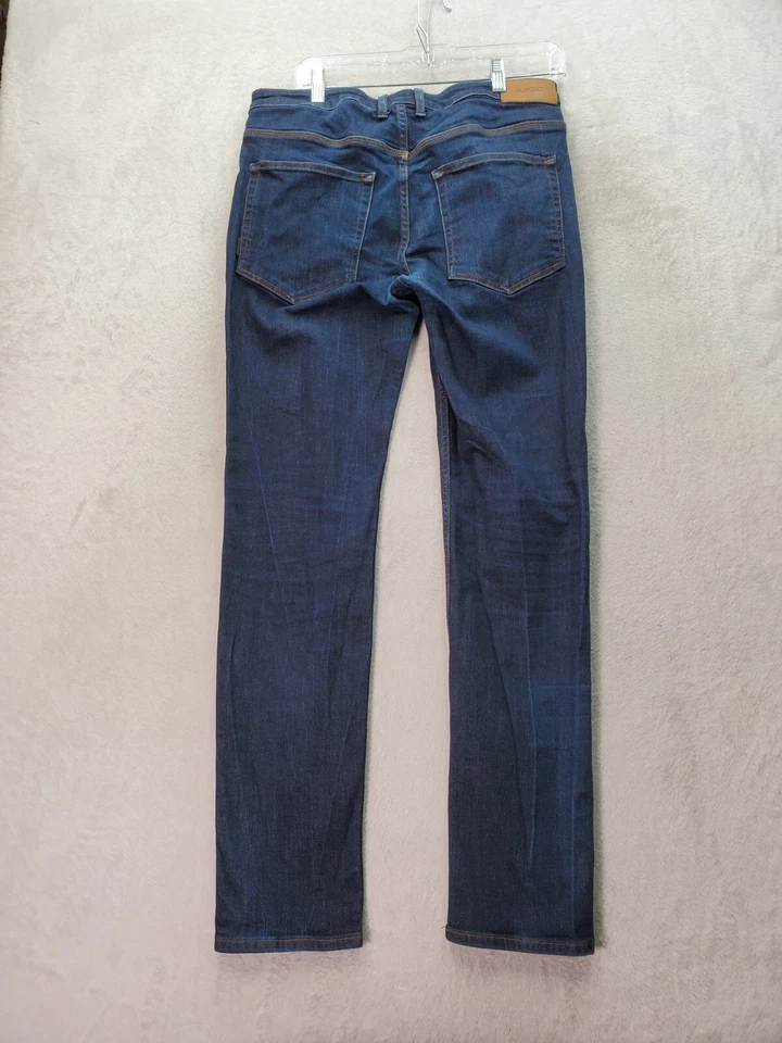 Pantalones de mezclilla WeSC para mujer talla 33 azul lavado oscuro frente plano pierna ajustada botón mosca Foto 2 de 4