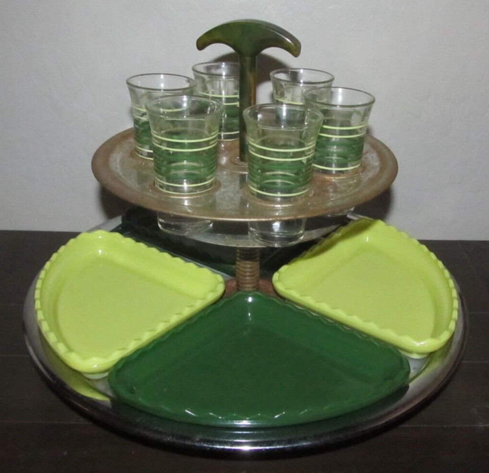 A MCM shot glass carousel lazy susan caddy is the kind of mid-century bar accessory that interior design accounts lose their minds over.