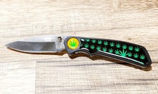 2271 Coltello tascabile caccia serramanico manico foglie marijuana + custodia.