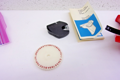 vintage red Dymo X-300 manual embossing label maker w extra wheel