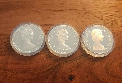 LOT OF 3 - (2) 1975 Canada Silver Calgary & (1) 1982 Regina 50% Silver 1 Dollars
