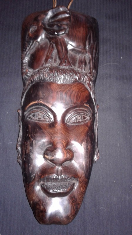 Hand carved strong and  brown  Ebony wood mask and  Elephant  attached. 