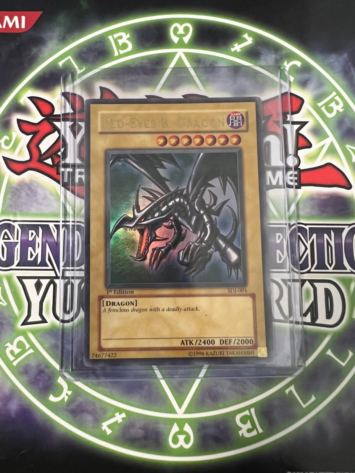 Red-Eyes Black Dragon being showcased by the seller.