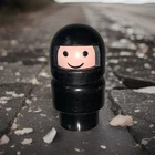 Vintage Fisher Price little people Indy Car Driver with black suit & helmet. X