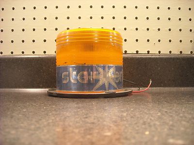 Intrups Star Bright II Amber Roof Mount Flashing Light. 12-48VDC. Used