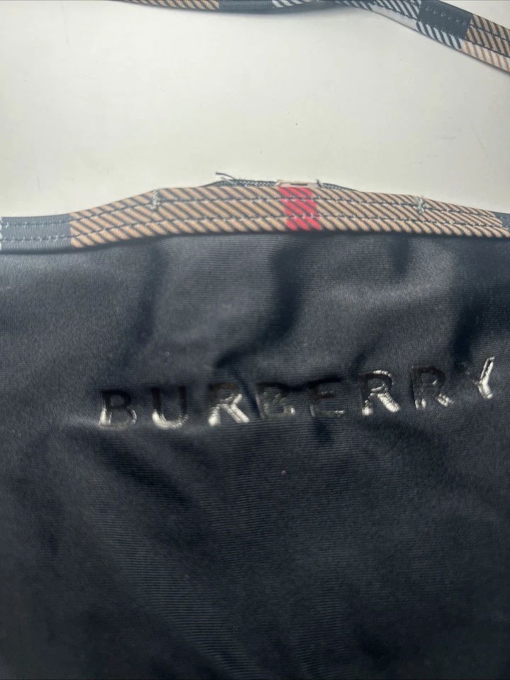 Parte inferior de bikini Burberry con tanga a cuadros grande, frente naranja y espalda negra Foto 3 de 4