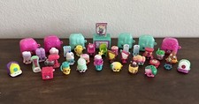 Shopkins and Storage 32 figures from mixed seasons - 7 storage cubes