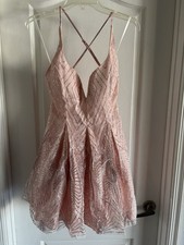 Pink dress with glitter accents. Ideal for parties.