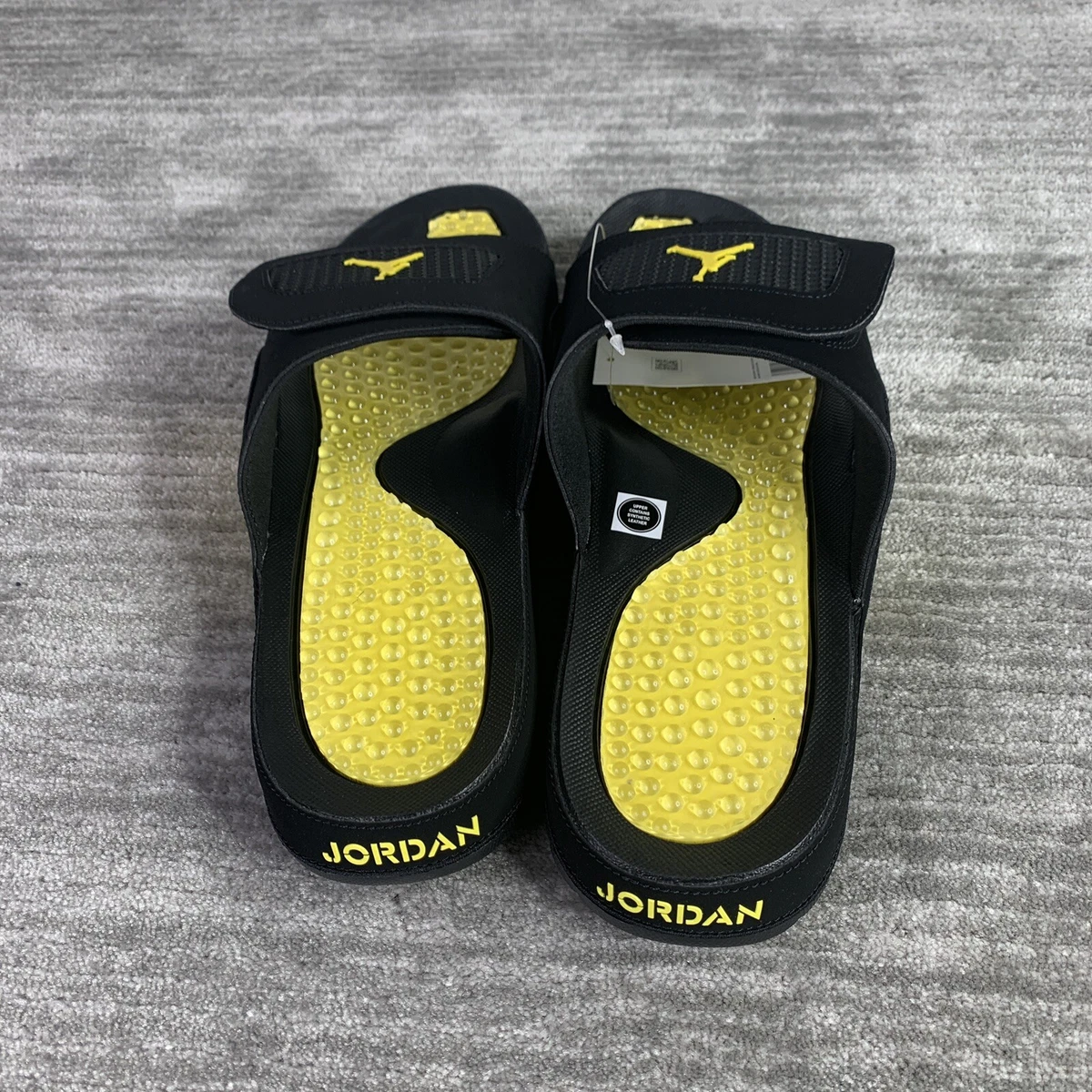 Yellow and black nike slides hot sale