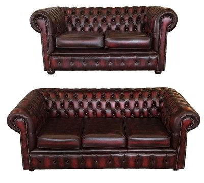 Divano Chesterfield Posti in Vera Pelle Di Colore Rosso Antico