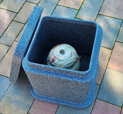 Vault for an urn, a container for a cremation urn to be buried in the ground.