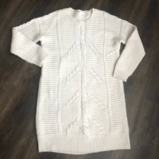 Beautiful knit dress/sweater. Flatteringi silhouette.