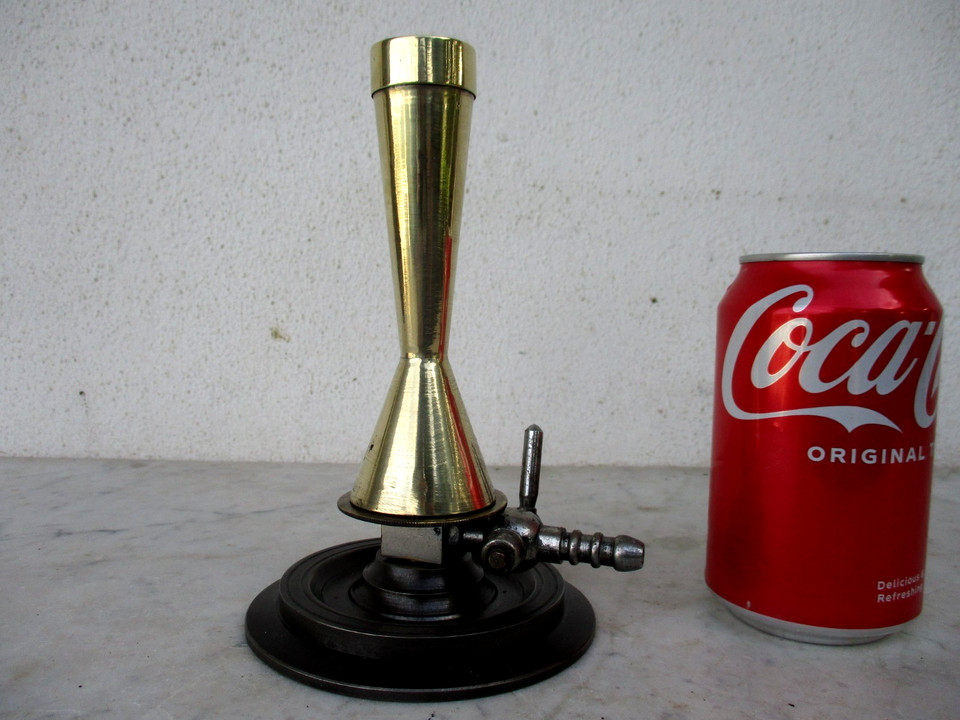 A genuine vintage brass Bunsen burner with tap — equal parts mad-scientist prop and elegant industrial artifact that looks straight out of a Victorian laboratory.