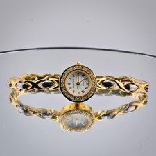 Glamour Women 97672  Gold Tone Round Quartz Analog 20mm. needs new battery.