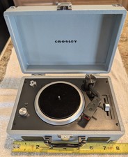 Crosley 3" Record Player Model: CR8050A-TN with 5 records included.