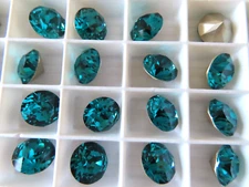 24 New Swarovski XIRIUS Rhinestones 45ss Blue Zircon/foiled. #1088