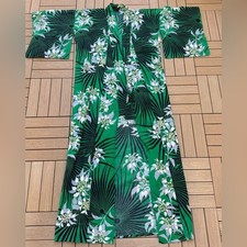Japanese-style cotton kimono featuring a green tropical leaf and floral pattern