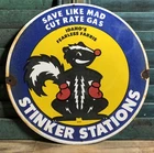 VINTAGE 1955 DATED STINKER STATION 12” PORCELAIN SIGN SKUNK FEARLESS FERRIS GAS
