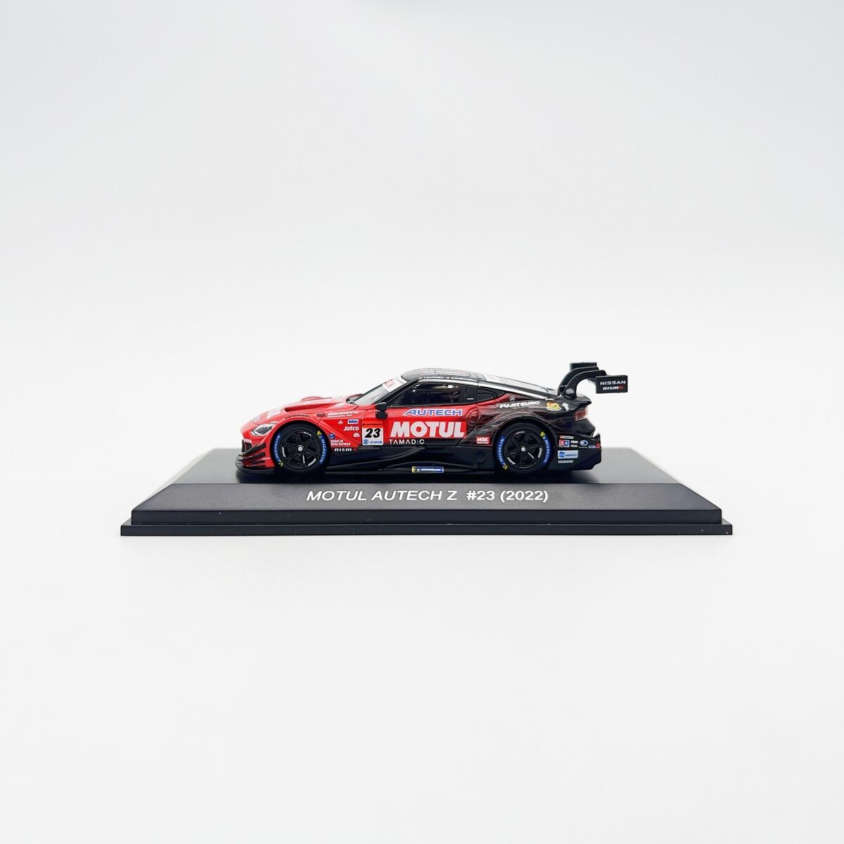 Kyosho 1:64 Motul Autech Z #23 2022 - Mini Car & Book Kyosho 1:64 Motul Autech Z #23 2022 - Mini Car & Book