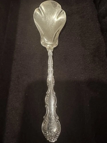 Gorham sterling silver serving berry  spoon in the Strasbourg pattern.
