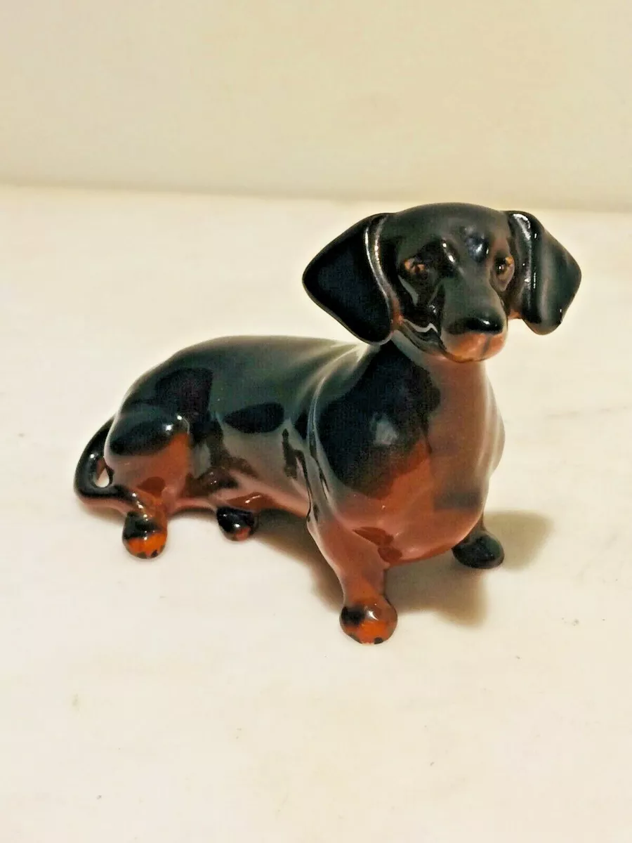 Dog figurines top made in england